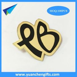 Black logo on gold metal pin badge
